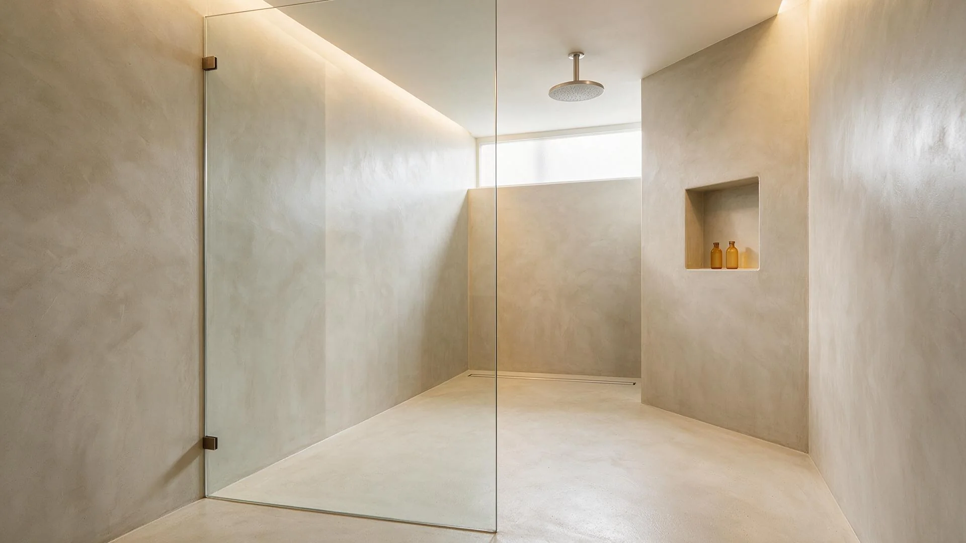 Luxury walk-in shower finished entirely in seamless pale greige microcement