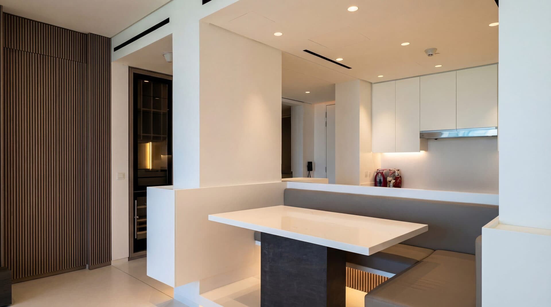 Modern Kitchen — Clean white with wood slat room divider