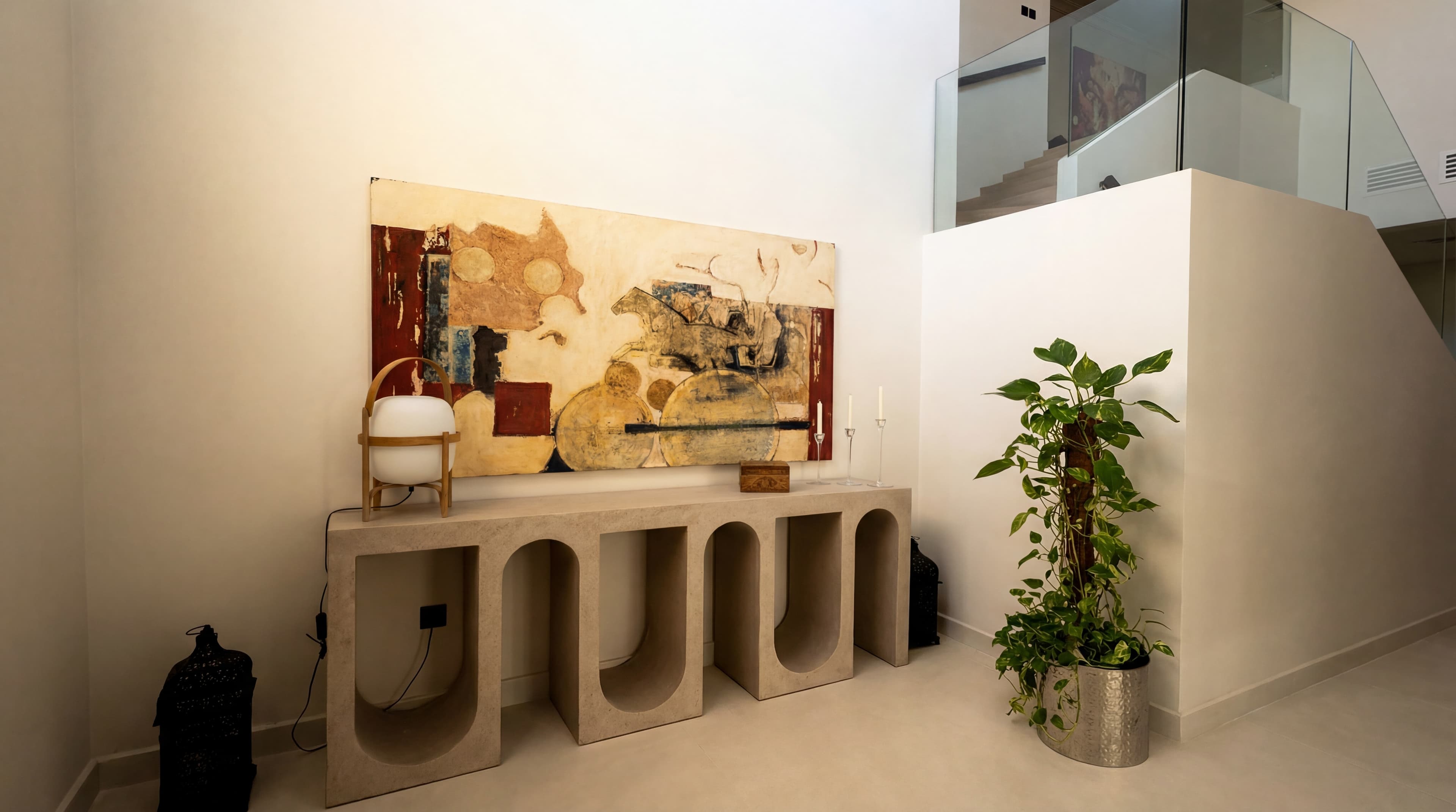 Villa Entry — Arched console with abstract art