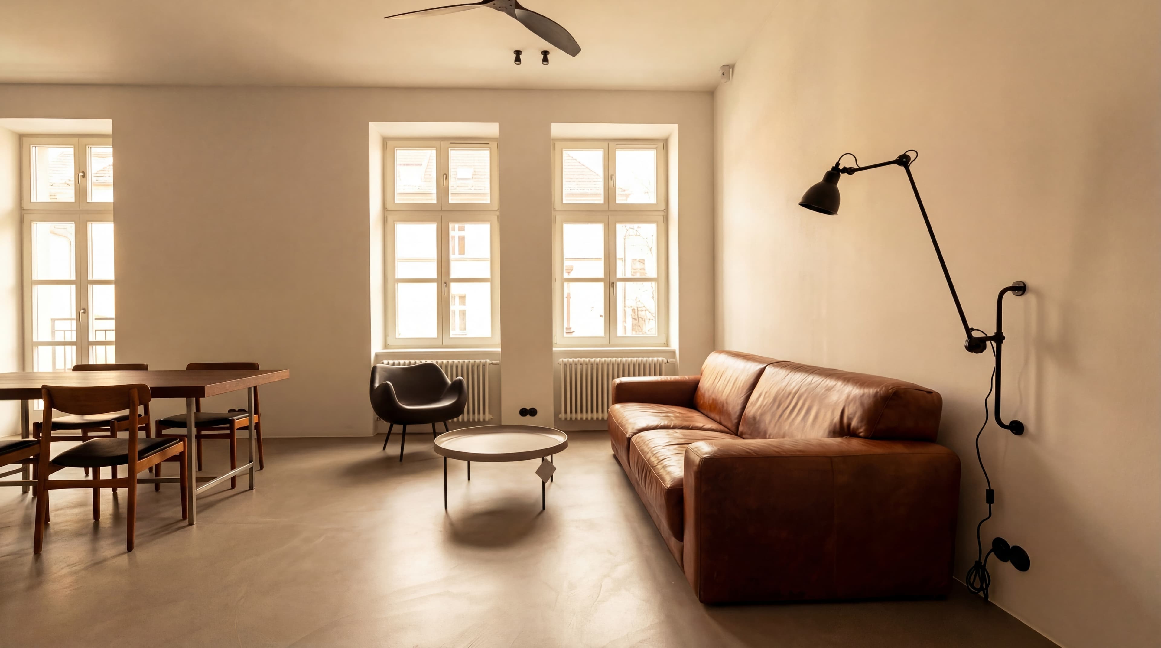 European Apartment — Brown leather with industrial lamp