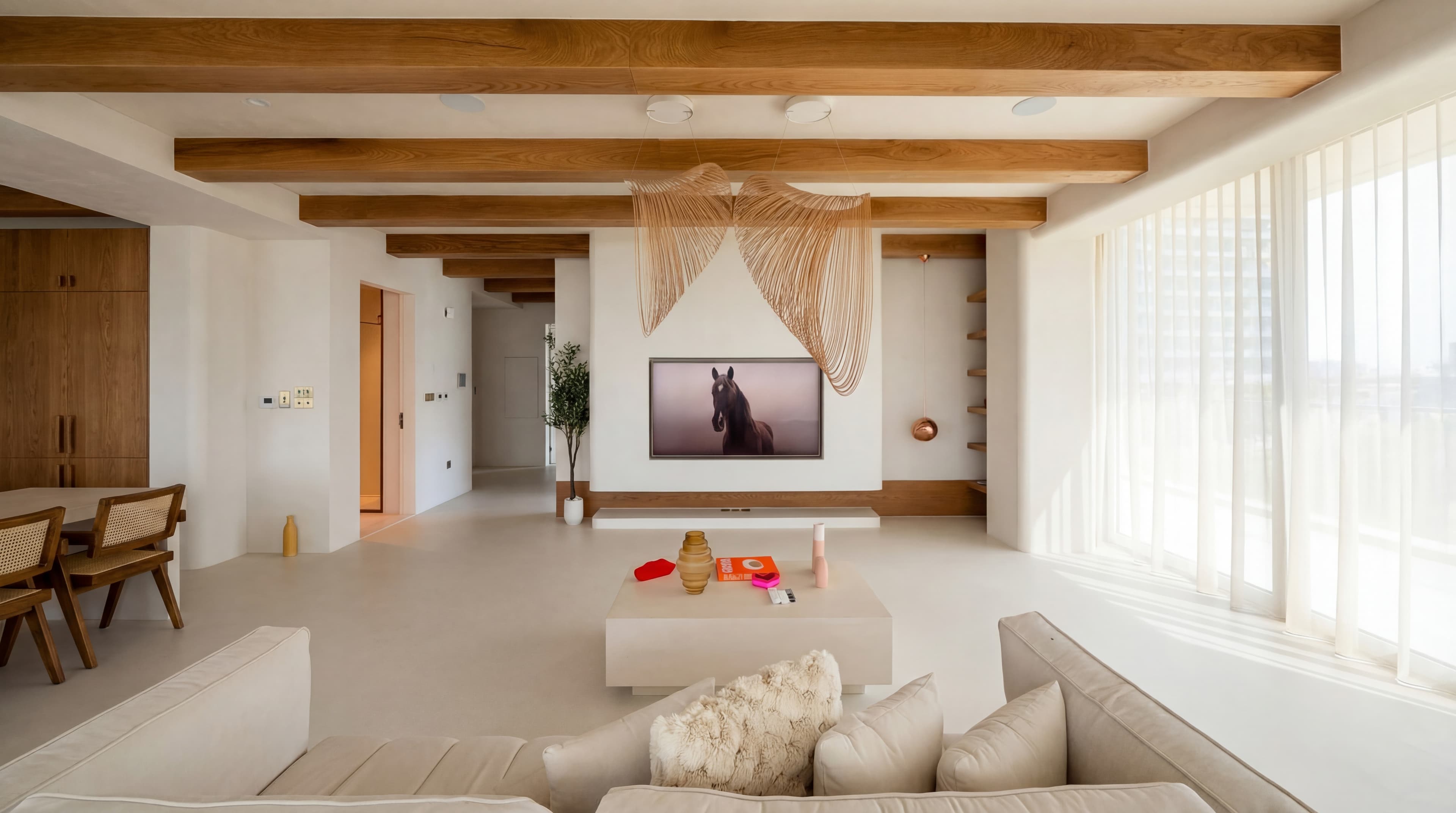 Macrame Living — Wall hanging behind TV with horse artwork