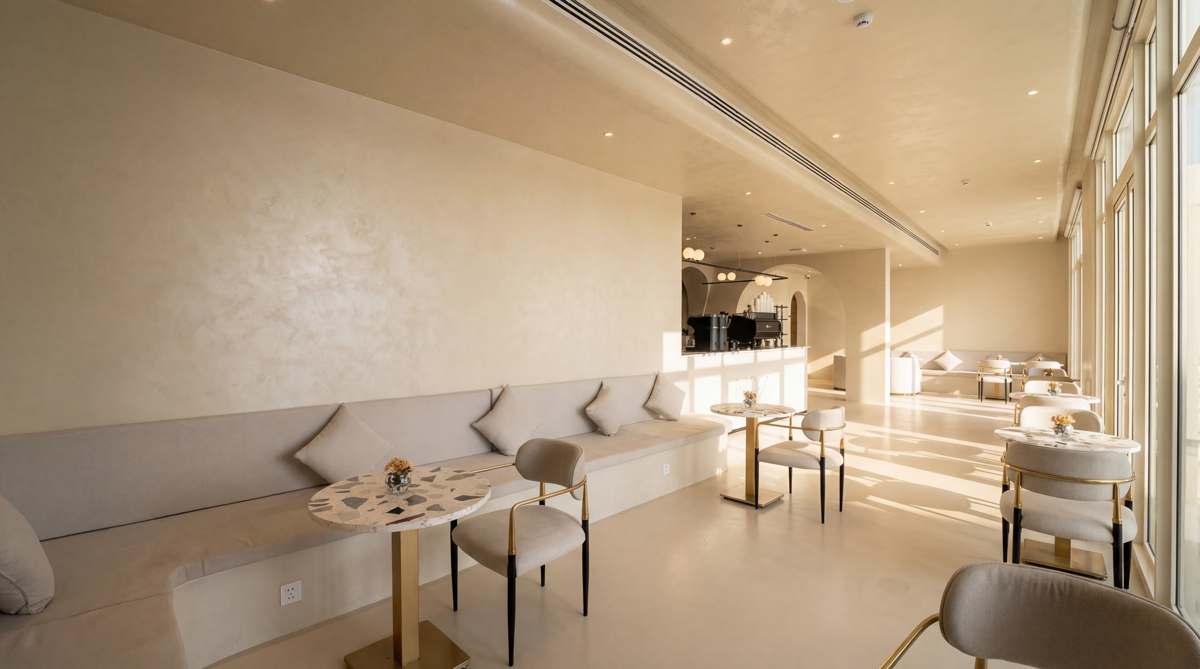 Cafe Lounge — Built-in banquette with marble tables