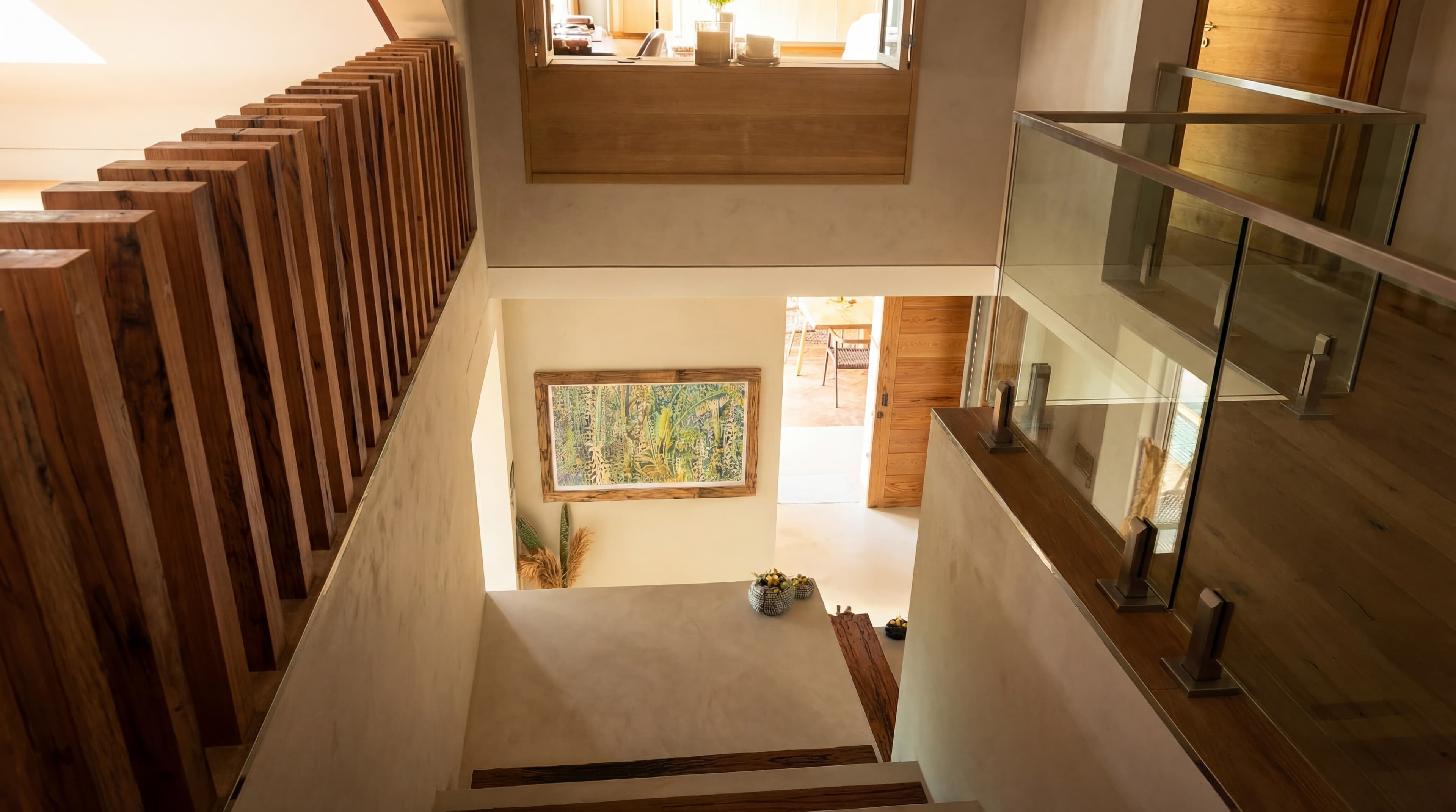 Art Villa Stairwell — Double-height with colorful paintings