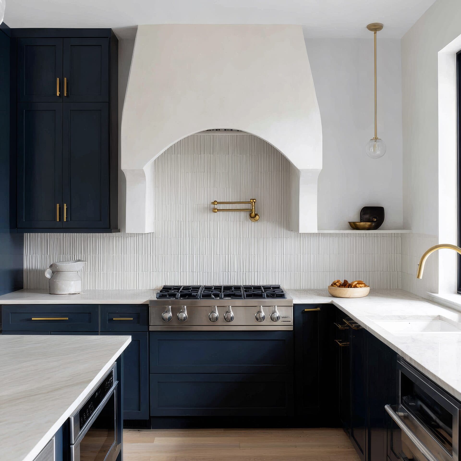 Seamless microcement floor and walls running continuously through an arched kitchen