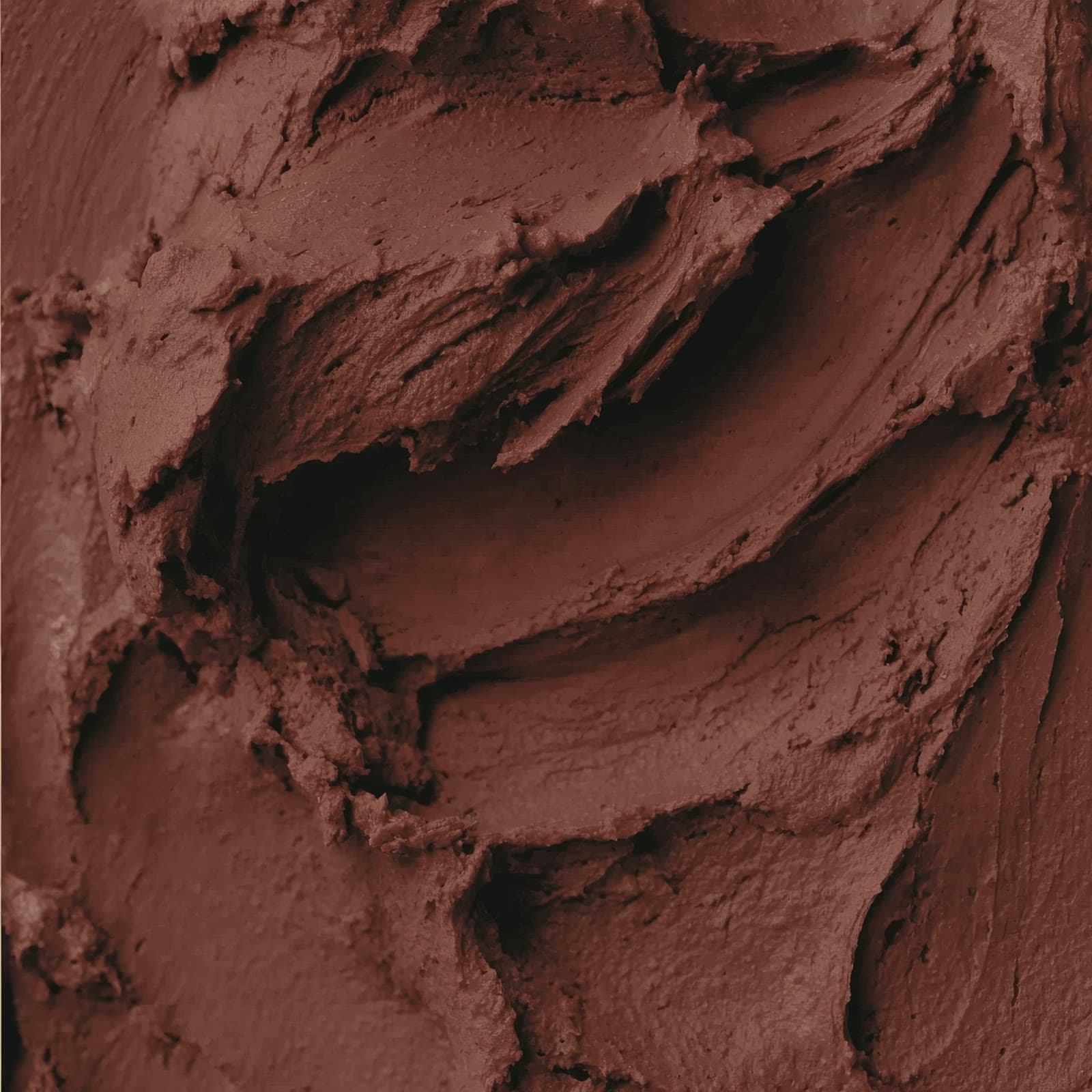 Macro close-up of cured microcement showing fine mineral aggregate and texture