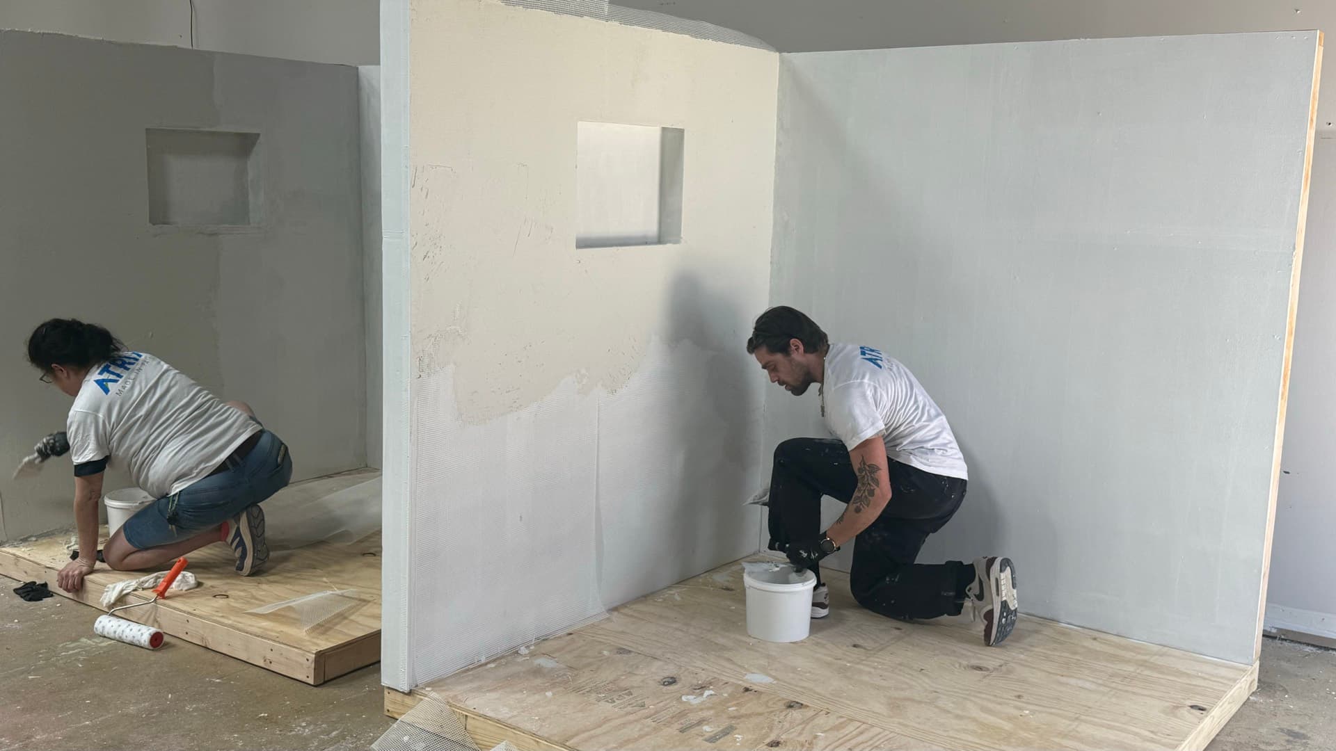 Every student gets a booth — walls, niche, and floor.