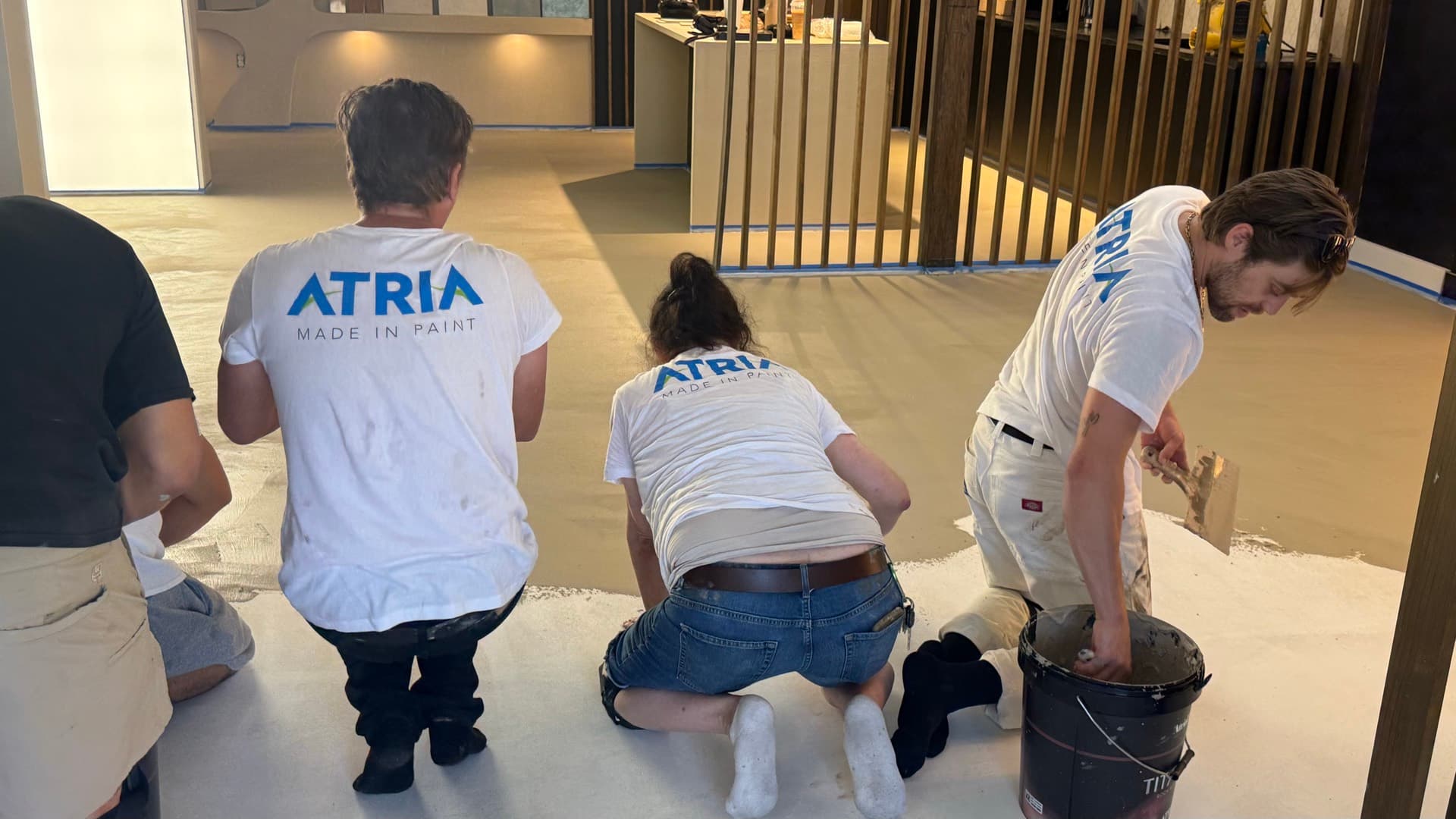 The showroom floor — the class installs a real 1,300 sq ft microcement floor in job-site conditions.