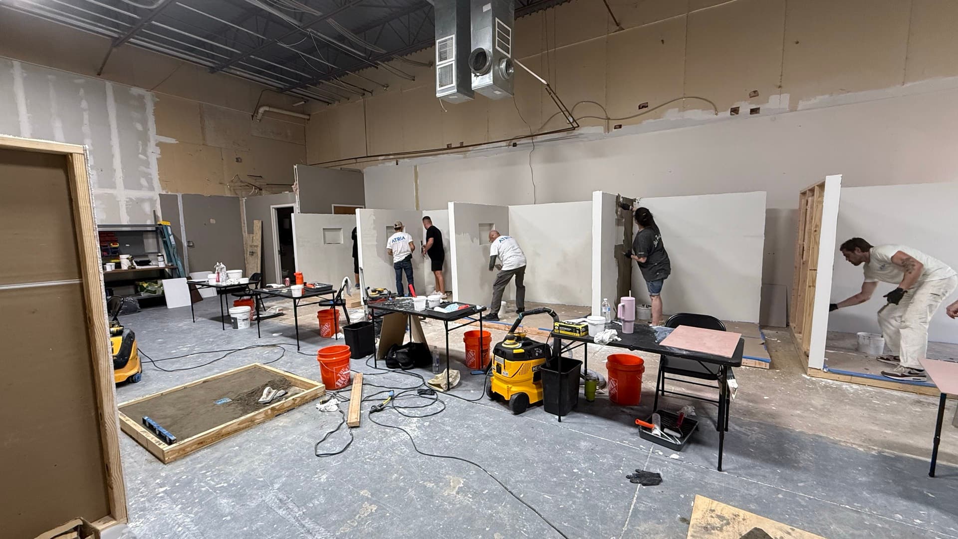 Eight seats, everyone troweling — no watching from chairs.